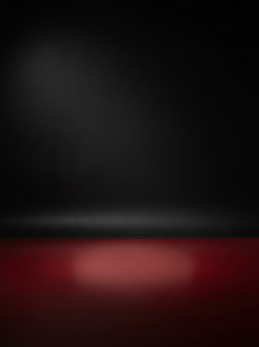 Matte black studio wall above a glossy red floor